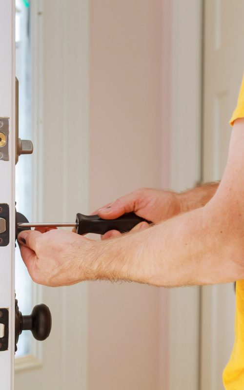 worker-installing-or-repairing-new-lock-handyman-repair-the-door-lock.jpg